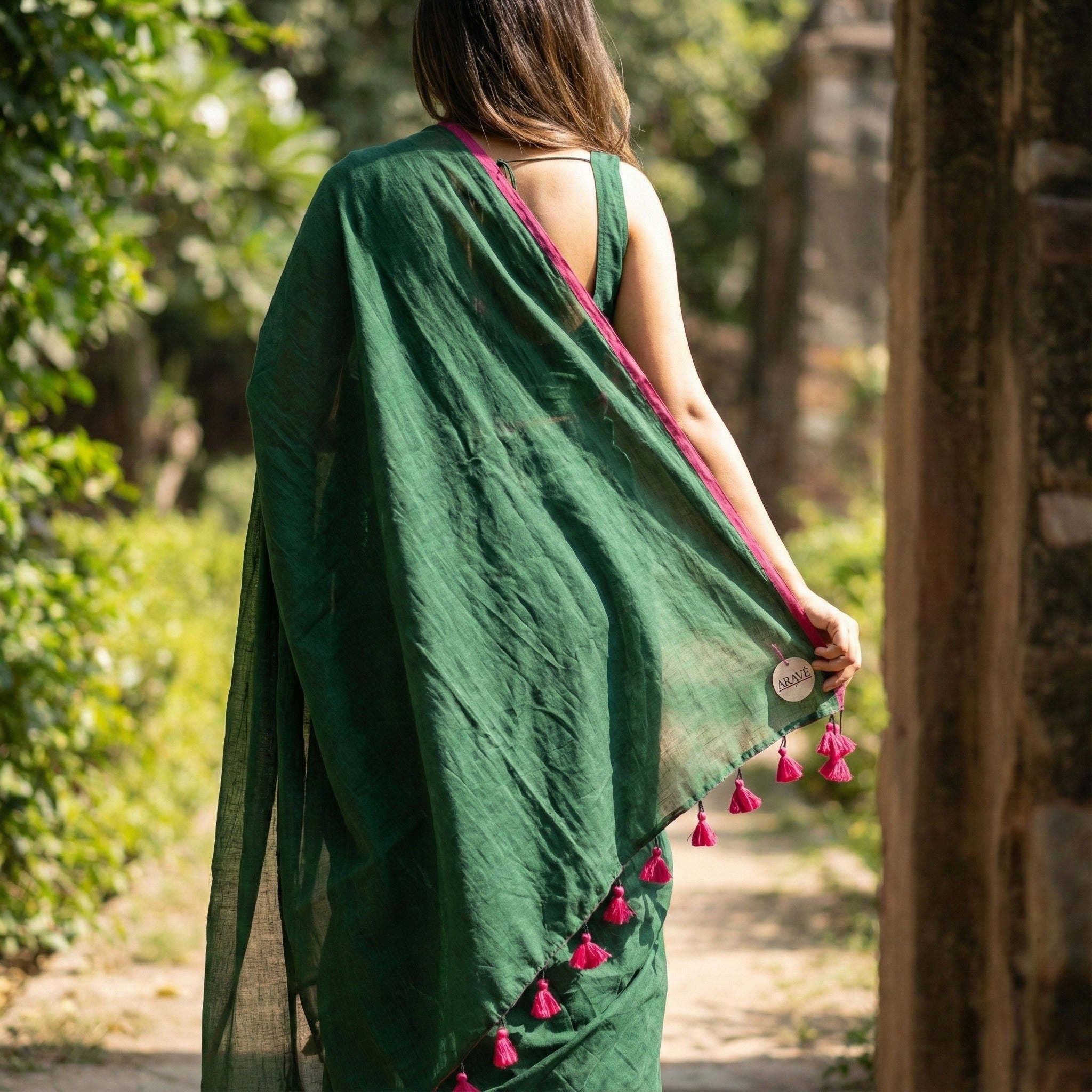 Gulabi Edge - Bottle Green Mulmul Saree with Thin Pink Border and Pink Tassels