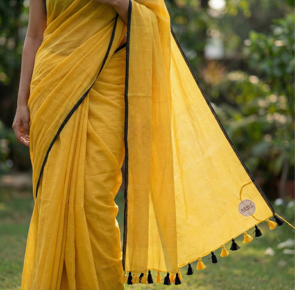 Sunehri Tale - Mango Yellow Mulmul Saree with Thin Black Border and Yellow–Black Tassels