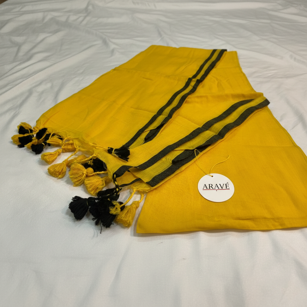 Sunehri Tale - Mango Yellow Mulmul Saree with Thin Black Border and Yellow–Black Tassels