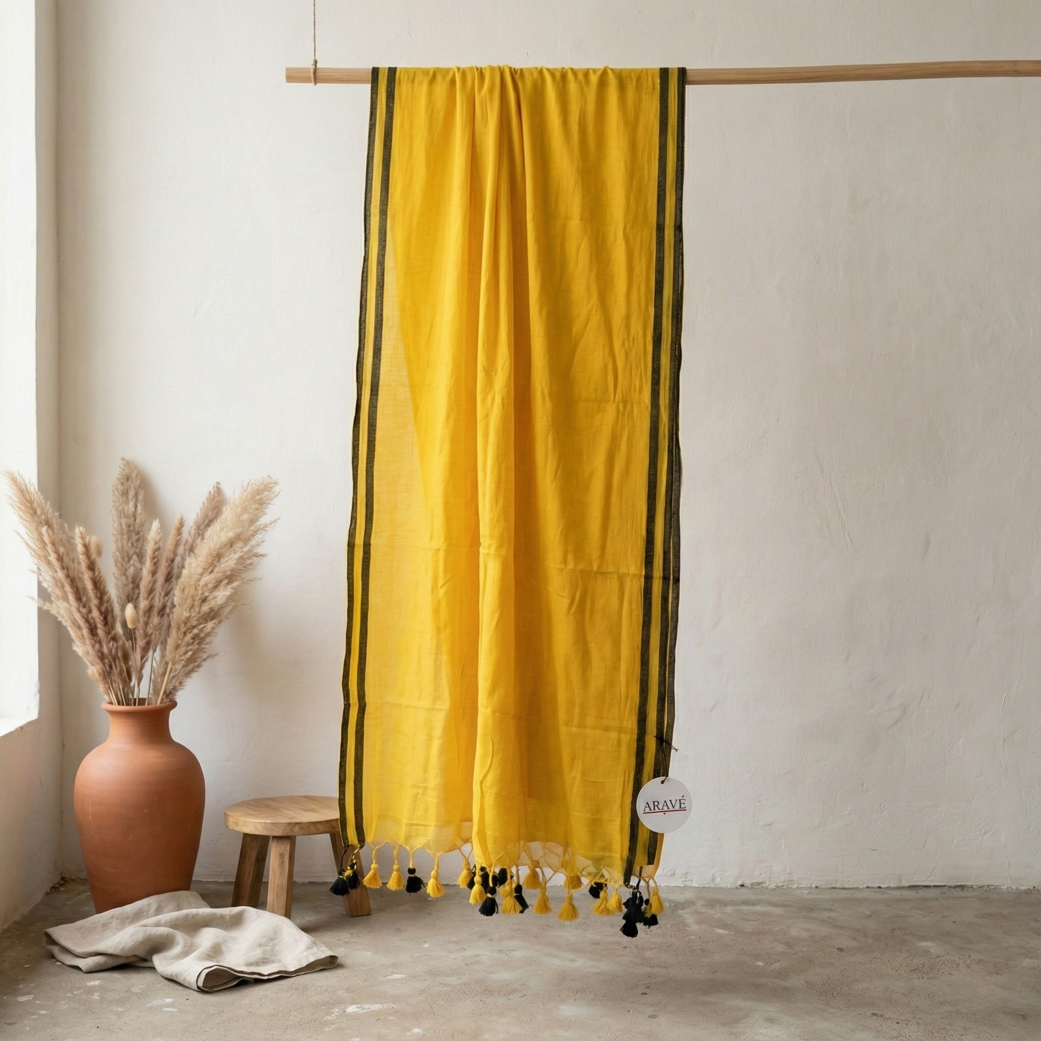 Sunehri Tale - Mango Yellow Mulmul Saree with Thin Black Border and Yellow–Black Tassels