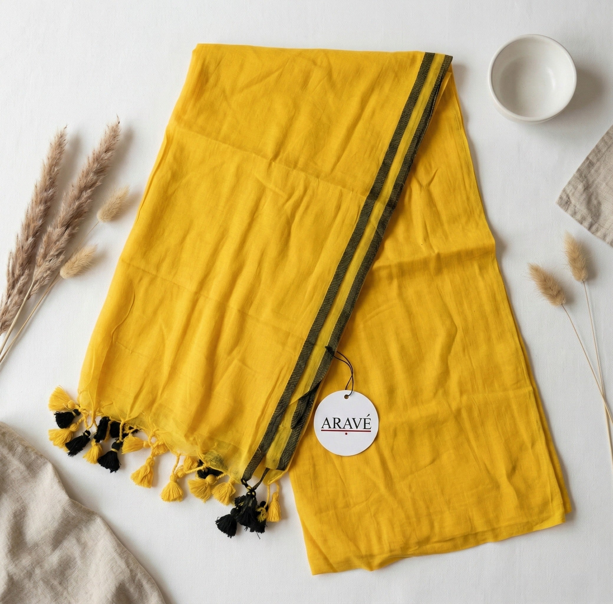 Sunehri Tale - Mango Yellow Mulmul Saree with Thin Black Border and Yellow–Black Tassels