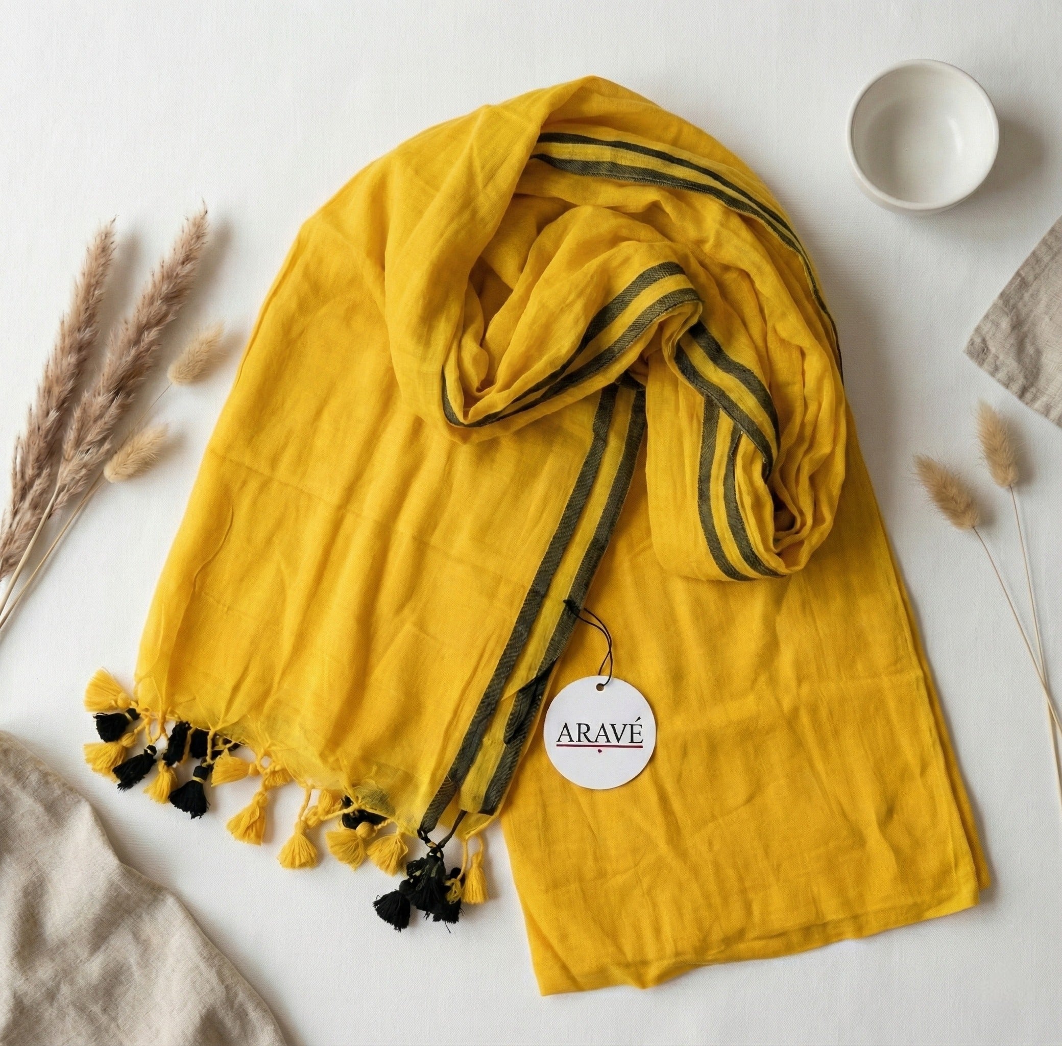 Sunehri Tale - Mango Yellow Mulmul Saree with Thin Black Border and Yellow–Black Tassels