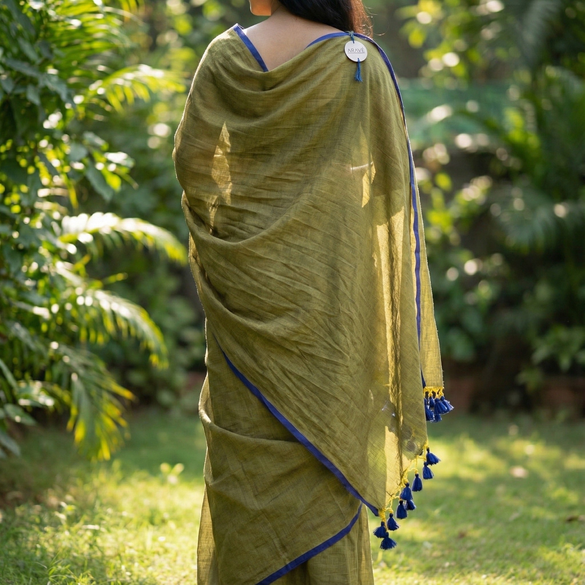 Neel Tara - Metallic Olive Mulmul Saree with Indigo Thin Border and Indigo Tassels