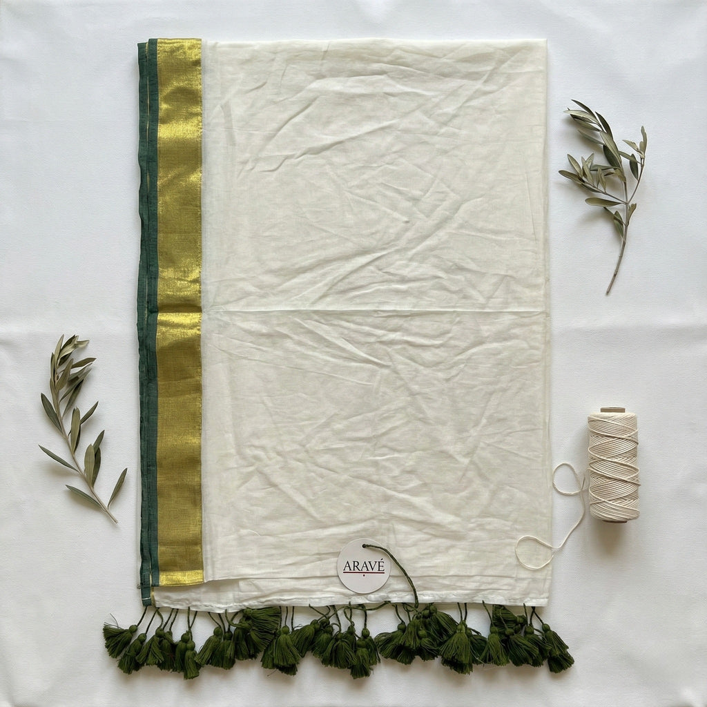 Shwet Adaa - White Mulmul Saree with Golden–Green Border and Green Tassels